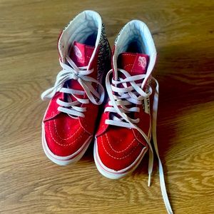 Unique high top red suede vans with black and white graffiti.